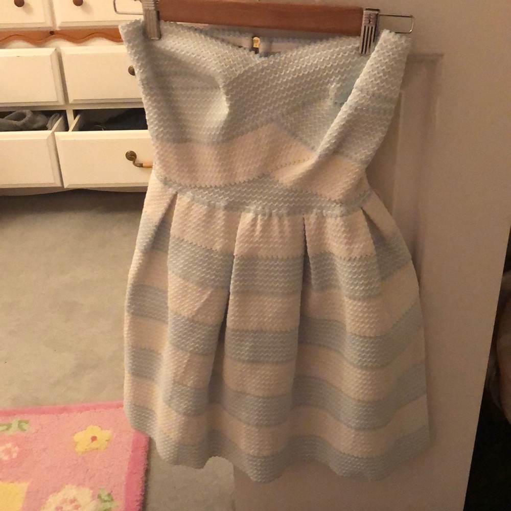 Blue and white strapless dress.